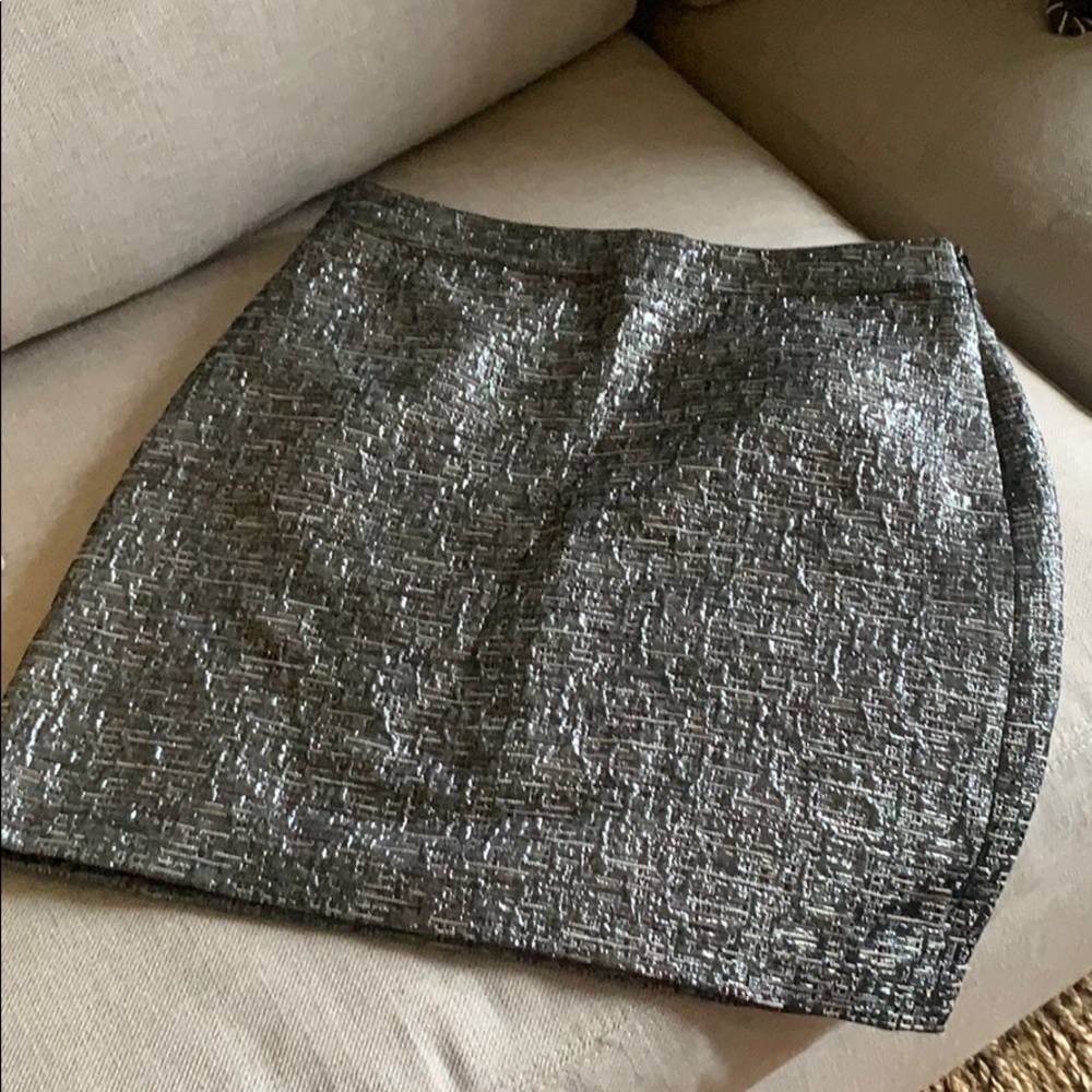 Silver mini skirt. New with tag. Size 4.